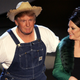 Donald Trump (L) and Actress Megan Mullally perform the Green Acres Theme onstage at the 57th Annual Emmy Awards held at the Shrine Auditorium on September 18, 2005, in Los Angeles.
